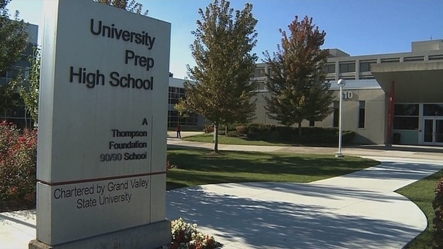 Photo of a sign in from of a building that says University Prep High School in Detroit, MI, A Thompson Foundation 90/90 School, Chartered by Grand Valley State University